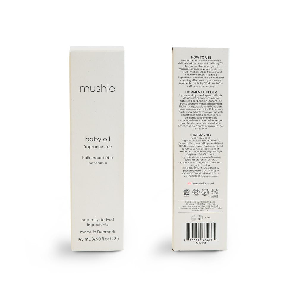 Mushie babyolie 145 mL parfumefri, Svanemærket, produceret i Danmark. Her set i hvid indpakning for og bag.