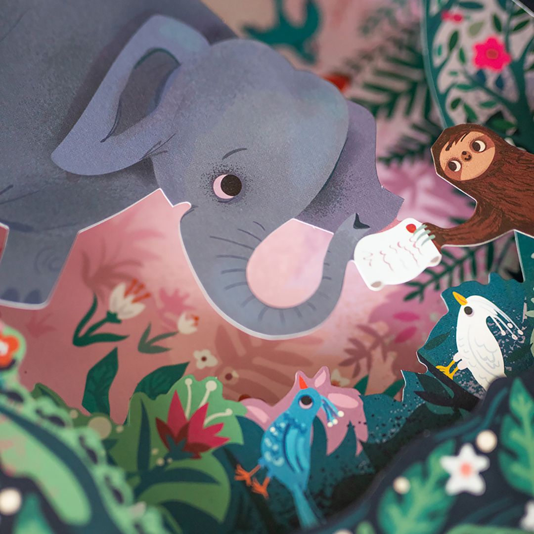 Dyrenes karneval, smuk og unik bog for børn 5- år med vilde dyr, musikstykker, illustrationer og papirklip. Her set med elefant og abe.