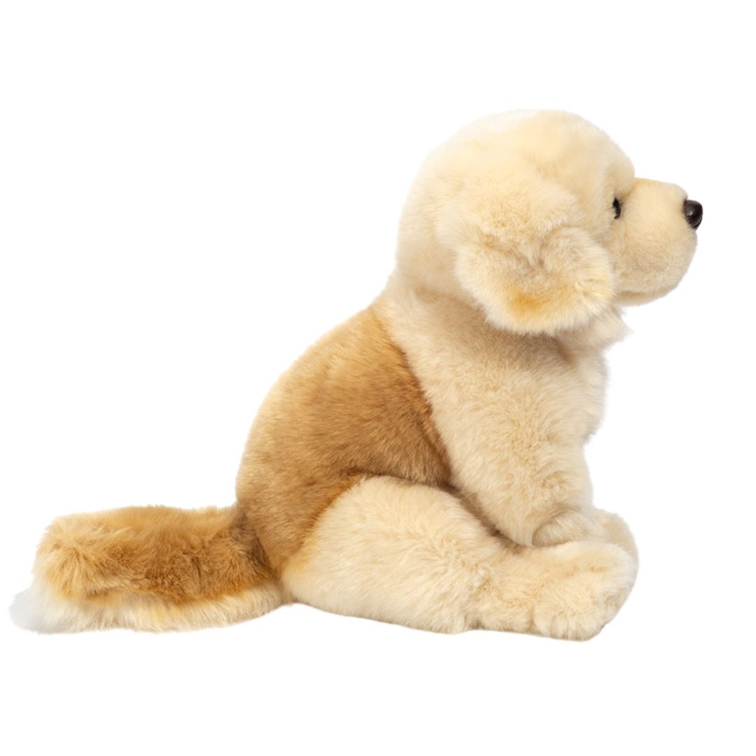 Golden retriever hvalp, bamsehund i lys, der sidder ned, set fra siden, fra Teddy Hermann fås hos Nordic Simply