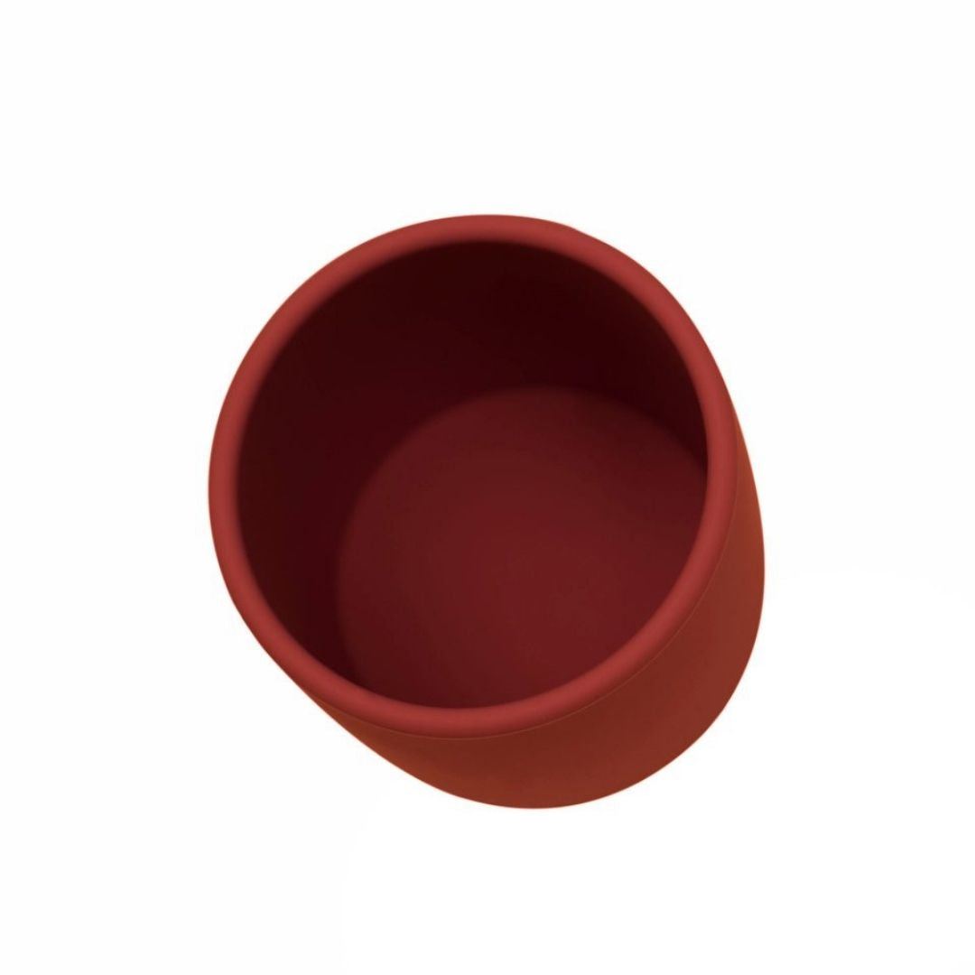 Lille rustfarvet babykop i silikone, set oppefra, fra We Might be Tiny fås hos Nordic Simply