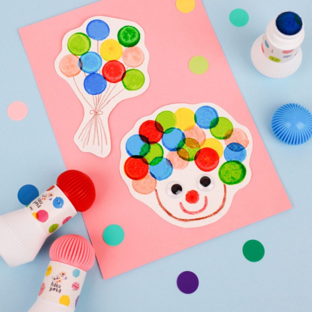 Farverige prikmarkører i brug, skabte sjove kunstværker med farverige prikker.