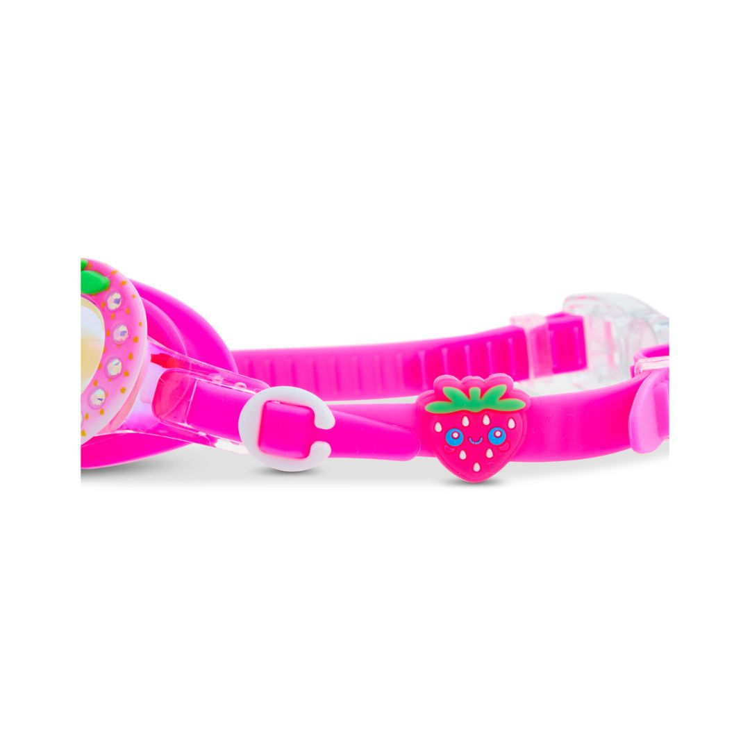 pink svømmebriller med glimmer og glas formet som jordbær fra Bling20, set fra siden med jordbær på remmen.