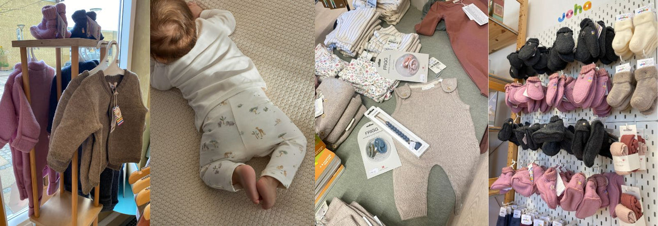 Babytøj og børnetøj i Nordic Simply's fysiske butik i Store Heddinge. Her ses Joha heldragter i uld, Baby i lyse Little Dutch leggings, heldragt i beige fra Little Dutch ligger på bord samt Joha strømper, vanter og futter hænger på væg