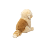 Golden retriever hvalp, bamsehund i lys, der sidder ned fra Teddy Hermann hos nordicsimply