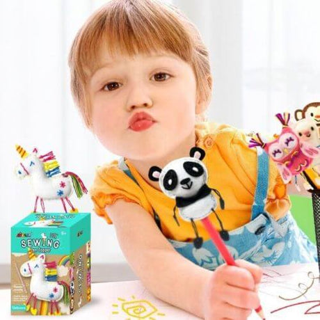 Child playfully posing with DIY Panda pencil topper kit, showcasing creative fun in sewing and decoration.