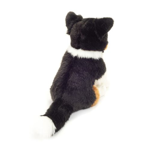 Sød Border Collie bamsehund, 30 cm, siddende set bagfra fra Teddy Hermann, perfekt til kram og leg.