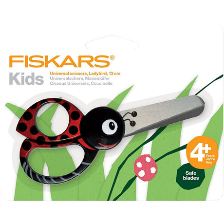 rød og sort børnesaks fra Fiskars formet som mariehøne, brug som både højre og ventrehåndssaks, set i indpakning.