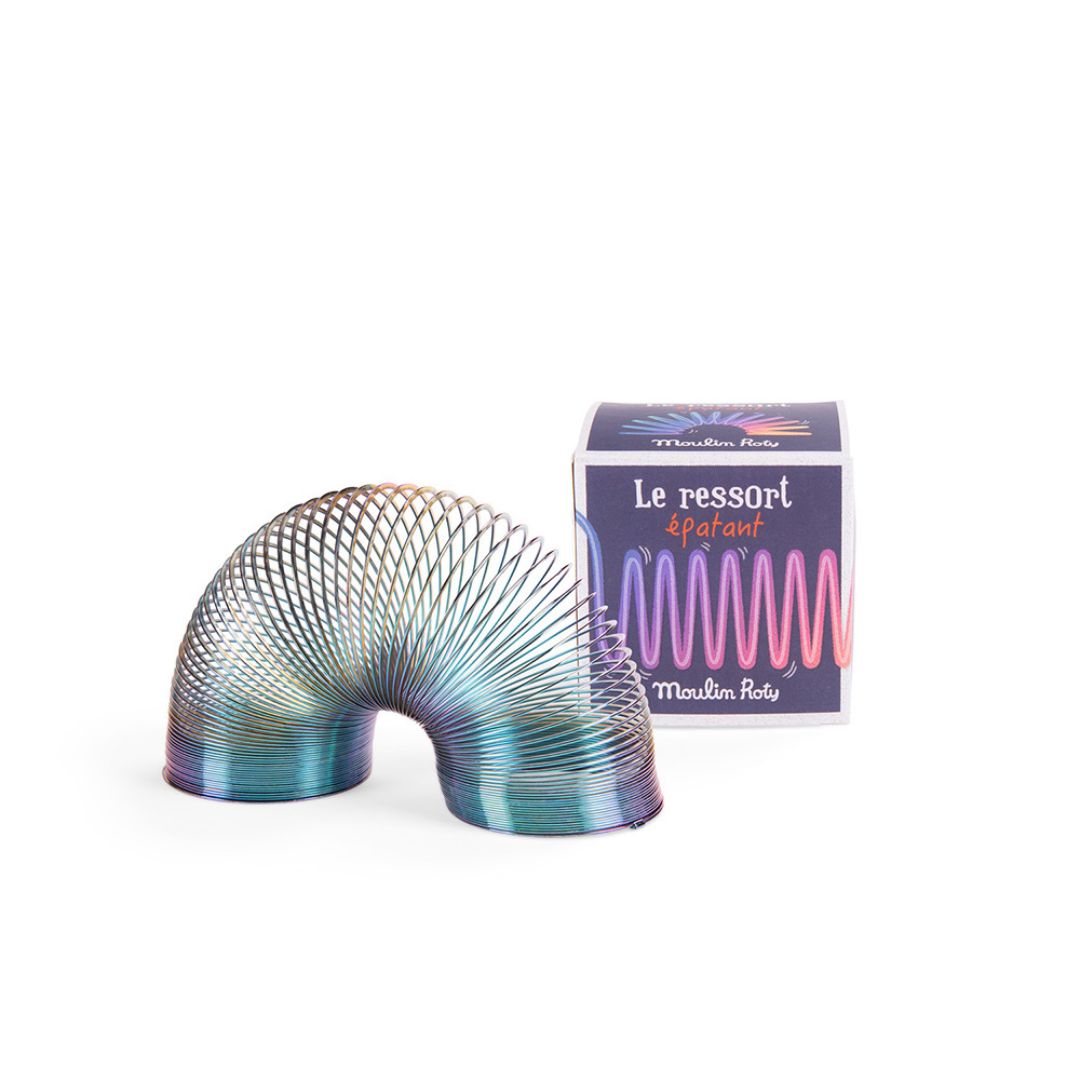 Gående fjeder i carbon stål fra Moulin Roty, set ved siden af æske, se den gå ned ad trapper og leg med fysik og tyngdekraft, god til store børn