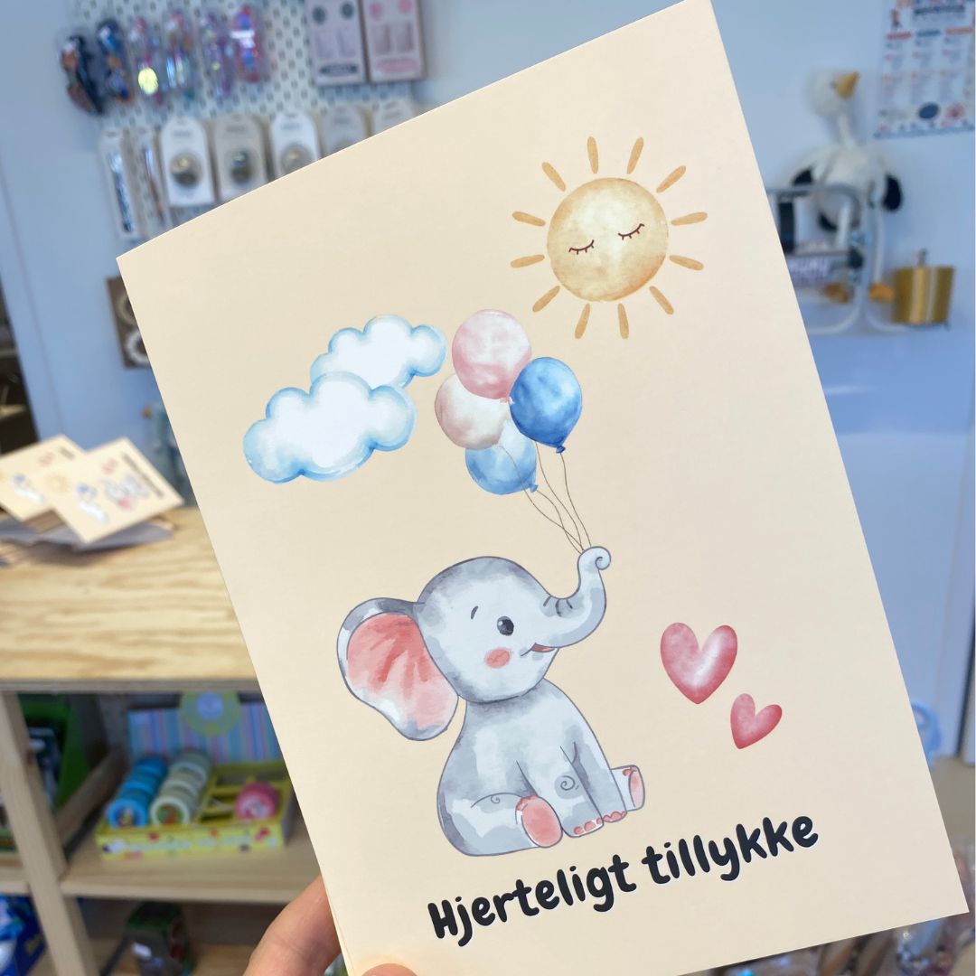 lykønskningskort A5 med motiver af elefant med balloner og teksten hjerteligt tillykke. Flot dobbeltkort til dåb, fødselsdag og andre anledninger for børn.