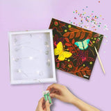 DIY lysboks kit with fairy lights, vibrant butterfly design, and sparkles for creative night-time decor.