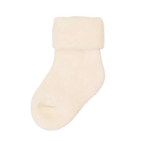 beige strømpe i uld til baby. Joha babystrømpe i uld med kant der kan rulles op og ned. Farve off white.